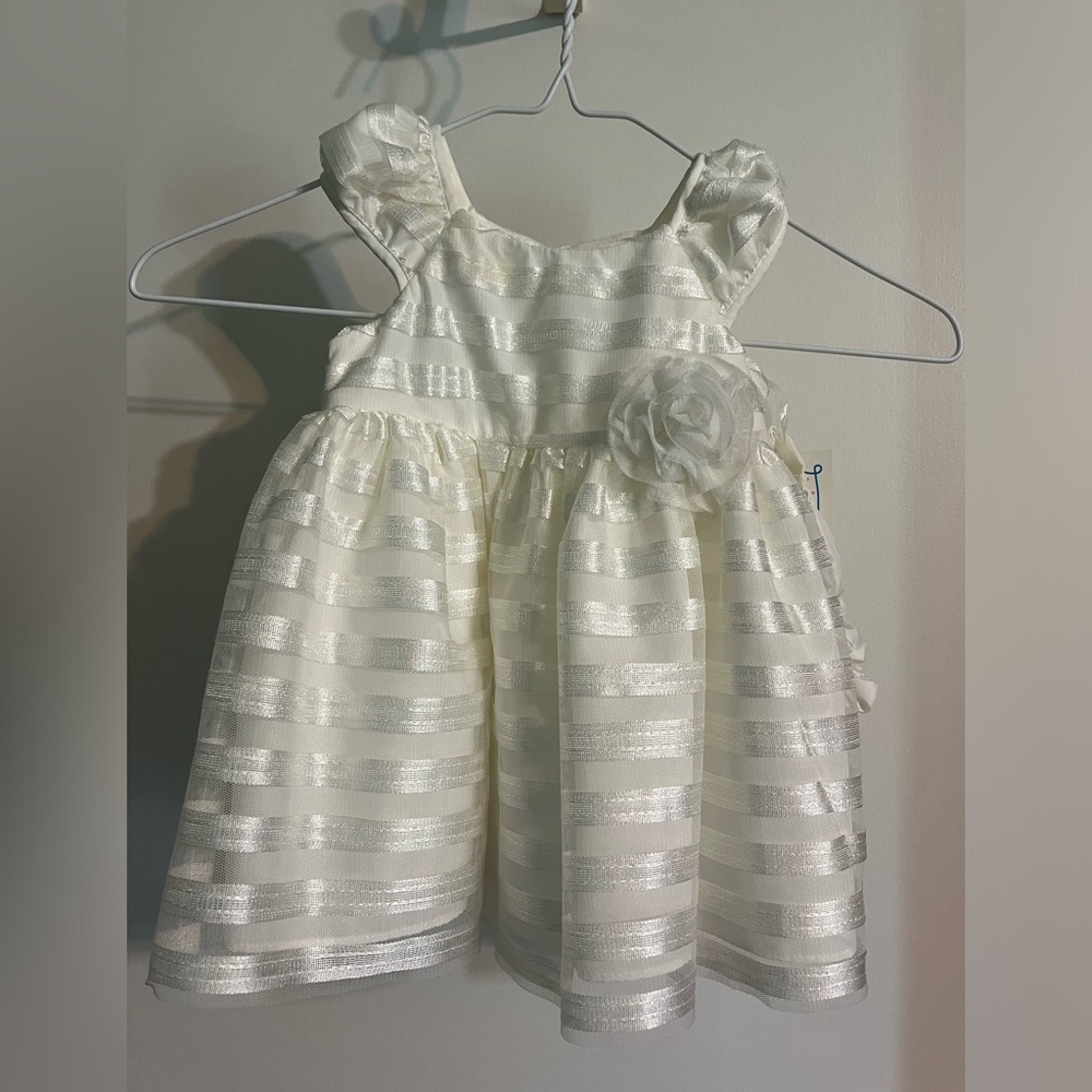 NWT Marmellata cream dress 6-9 months. Comes with head bow.